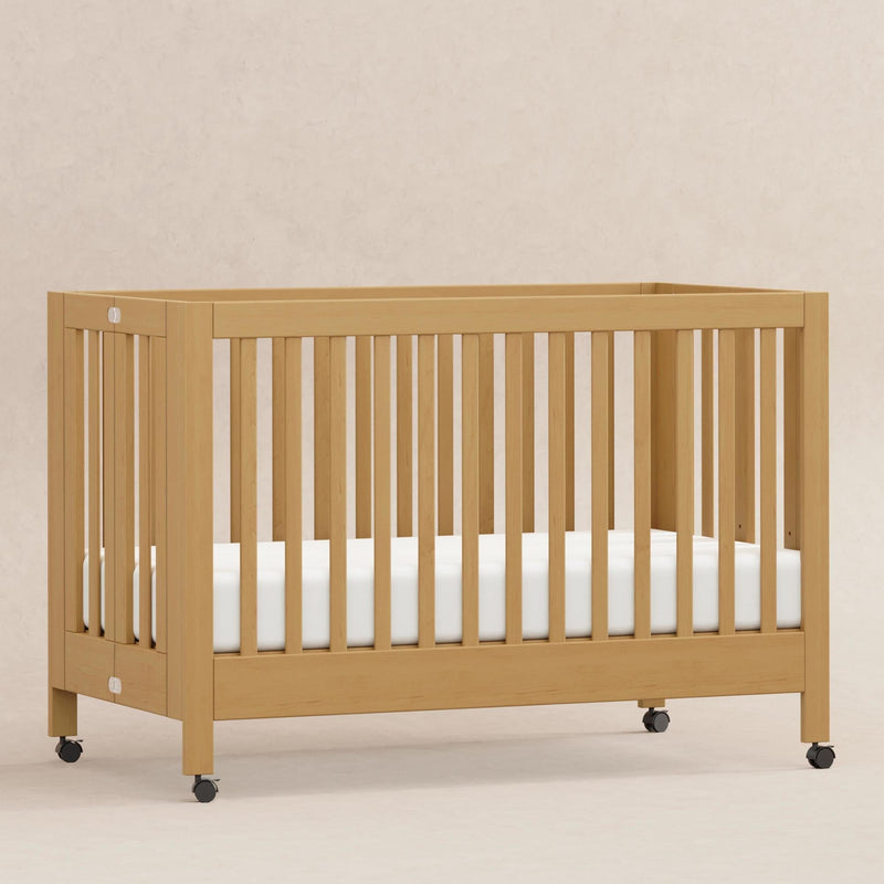 Load image into Gallery viewer, Babyletto Maki Portable Folding Crib with Toddler Bed Conversion Kit
