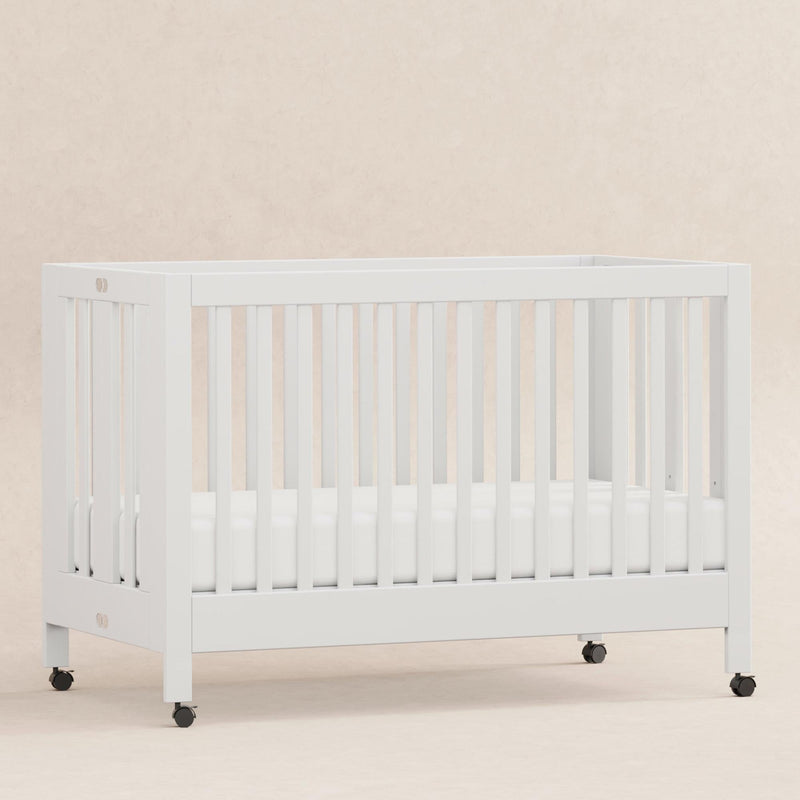 Load image into Gallery viewer, Babyletto Maki Portable Folding Crib with Toddler Bed Conversion Kit
