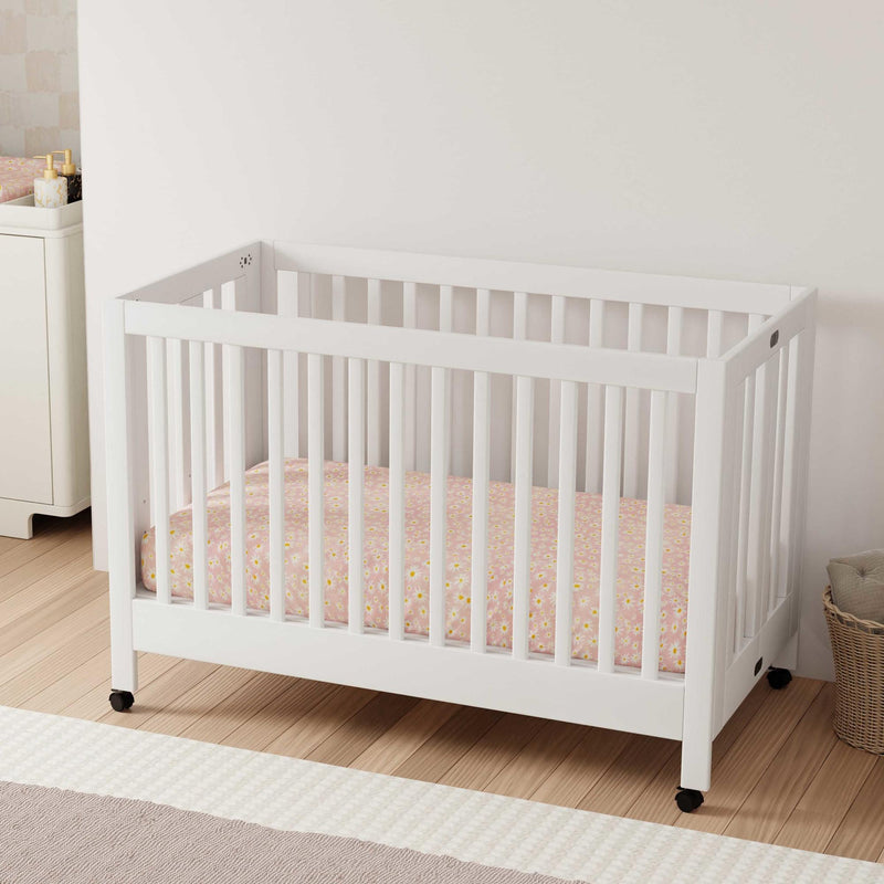 Load image into Gallery viewer, Babyletto Maki Portable Folding Crib with Toddler Bed Conversion Kit
