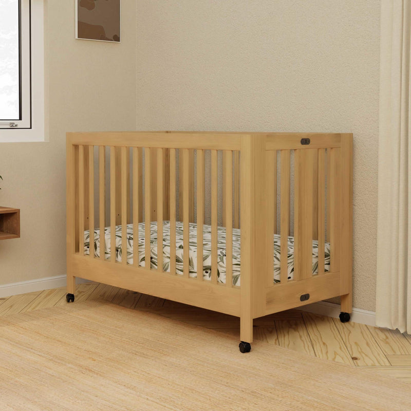 Load image into Gallery viewer, Babyletto Maki Portable Folding Crib with Toddler Bed Conversion Kit
